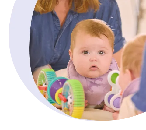 baby looking into a mirror