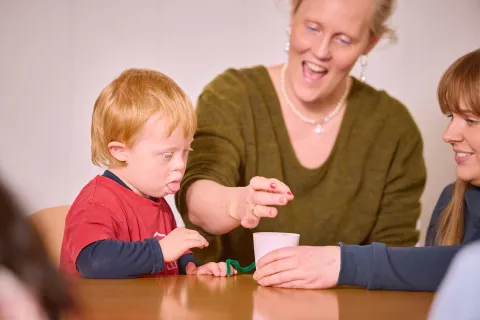 son and mother playing