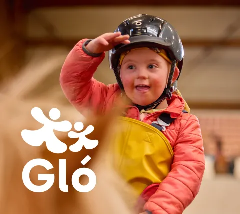 boy on horse back smiling