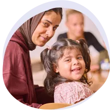 mother and daughter smiling