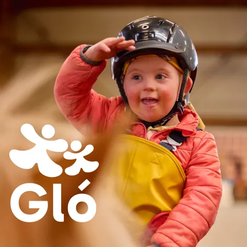 boy on horse back smiling