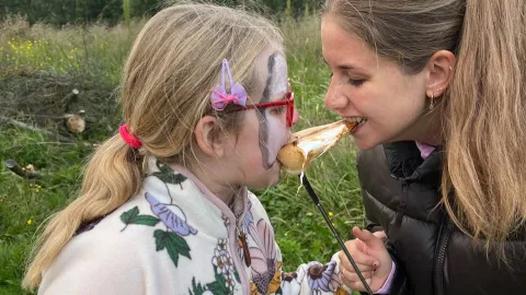 Girls eating marsmellows