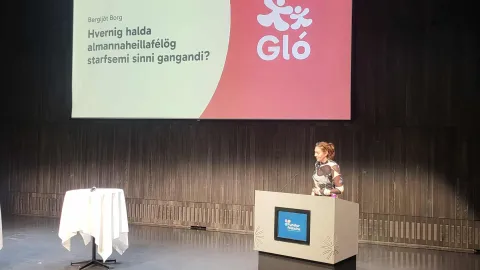 woman on conference stage