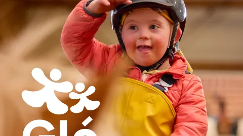 boy on horse back smiling